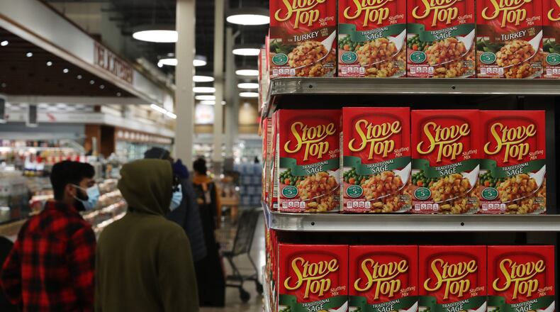 Stuffing mix is stocked and on display for Thanksgiving dinner items at a Pete's Fresh Market Tuesday, Nov. 2, 2021, in Glen Ellyn, Illinois. Overall food prices are up for the last year, and that means paying more for Thanksgiving dinner.