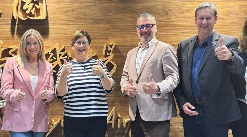 In this image supplied by the Taiwan Ministry of Foreign Affairs (MOFA), New Zealand lawmakers from left, Laura McClure, Maureen Pugh, Duncan Webb and David Wilson gesture as they pose for a photo at Taiwan Taoyuan International Airport, on May 4, 2026. (Taiwan MOFA via AP)