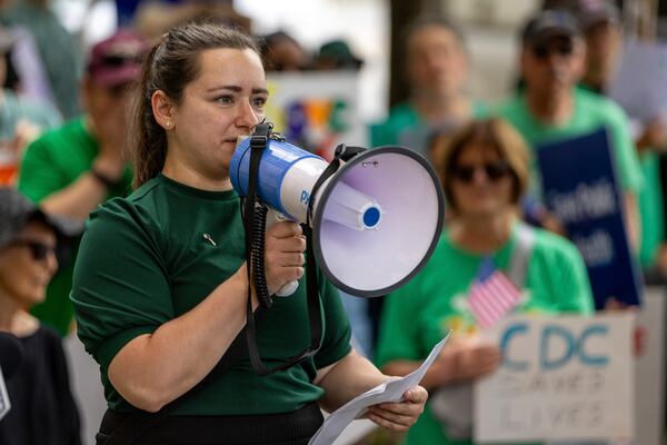 Anna Yousaf speaks at a demonstration protesting President Donald Trump's proposed cuts to health services outside Centers for Disease Control and Prevention (CDC) headquarters in Atlanta on Tuesday, June 10, 2025. (Arvin Temkar/Atlanta Journal-Constitution via AP)