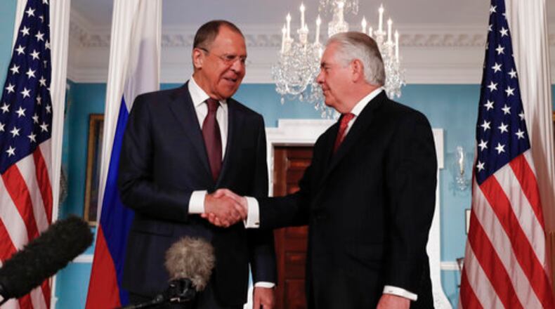 Secretary of State Rex Tillerson, right, shakes hands with Russian Foreign Minister Sergey Lavrov at the State Department in Washington, Wednesday, May 10, 2017. (AP Photo/Carolyn Kaster)