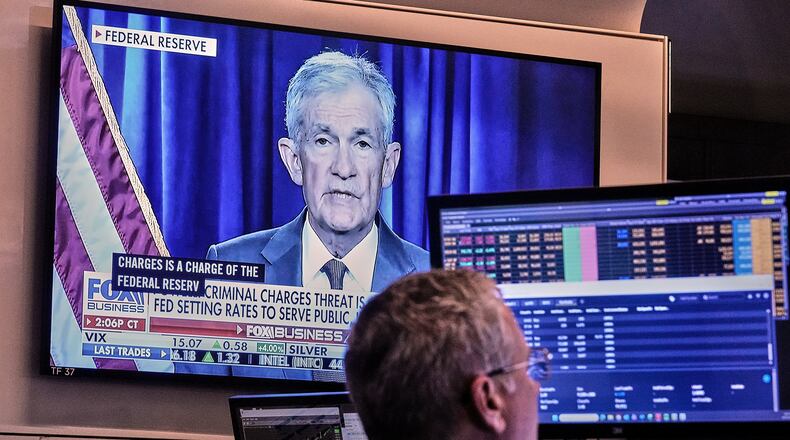 A video of Federal Reserve Chair Jerome Powell plays on a screen on the floor of the New York Stock Exchange, Monday, Jan. 12, 2026. (AP Photo/Richard Drew)