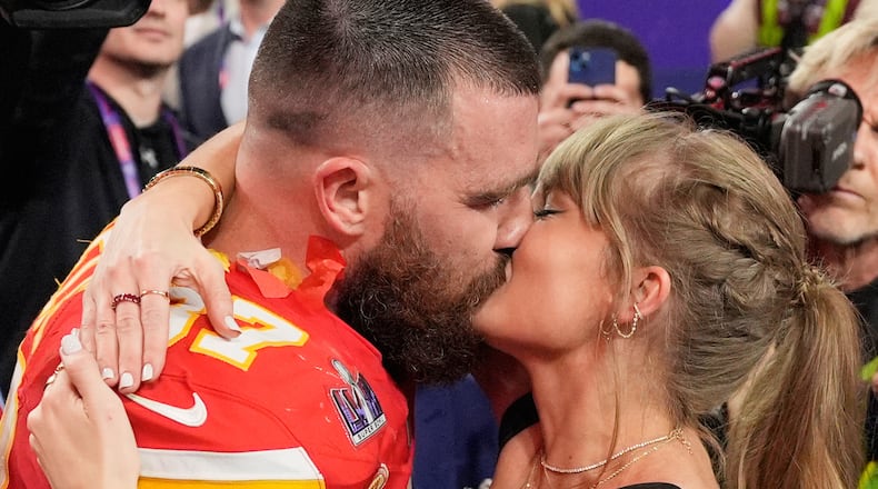 FILE - Kansas City Chiefs tight end Travis Kelce (87) and Taylor Swift kiss after the Chiefs defeated the San Francisco 49ers in the NFL Super Bowl 58 football game on Feb. 11, 2024, in Las Vegas. (AP Photo/John Locher, File)