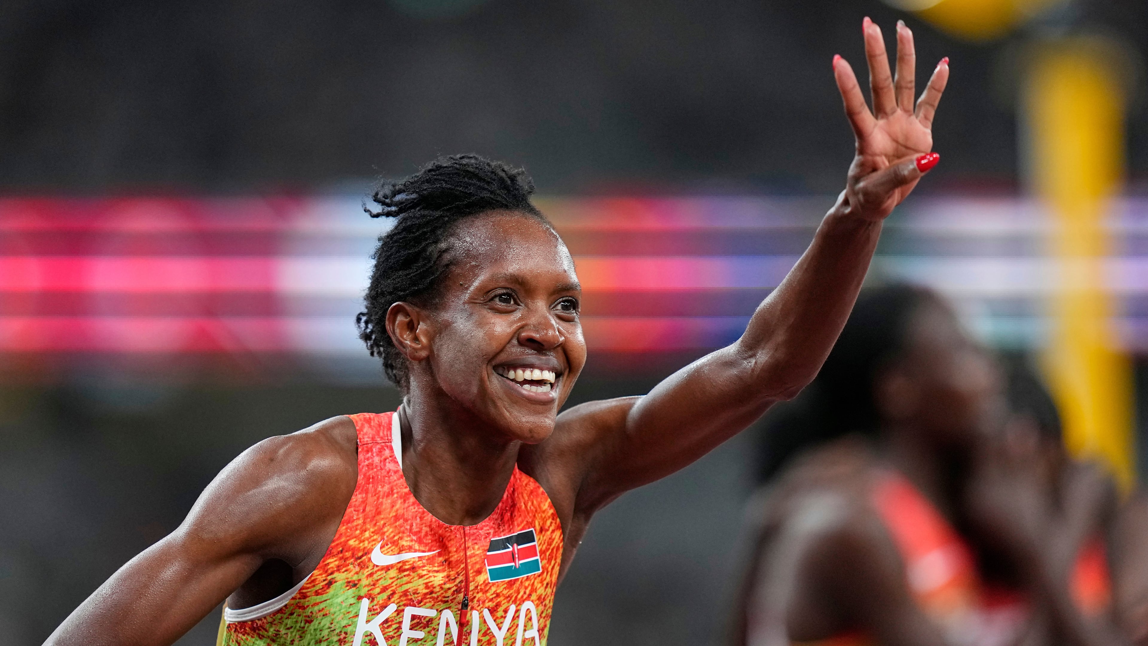Kenya's Faith Kipyegon celebrates winning the gold in the women's 1,500 meters final at the World Athletics Championships in Tokyo, Tuesday, Sept. 16, 2025. (AP Photo/Petr David Josek)
