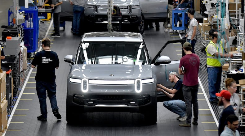 Manufacturing workers assemble electric vehicles at Rivian in Normal, Ill., on July 20, 2022. (Photo for the Atlanta Journal Constitution by Ron Johnson)