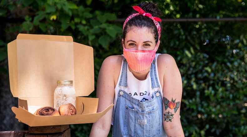 Abigail Cole is a self-taught baker who recently was promoted to head of bread at Proof, just before the restaurant closed. To make ends meet, she started baking small batches of bread and cinnamon rolls for individuals who placed orders online. It lets her keep paying the bills. (Jenni Girtman / Atlanta Event Photography)