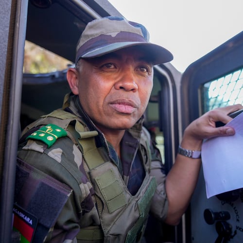 CAPSAT military unit commander Col. Michael Randrianirina and his troops make their way to the presidency to announce that the armed forces are taking control of the country in Antananarivo, Madagascar, Tuesday, Oct. 14, 2025. (AP Photo/Brian Inganga)