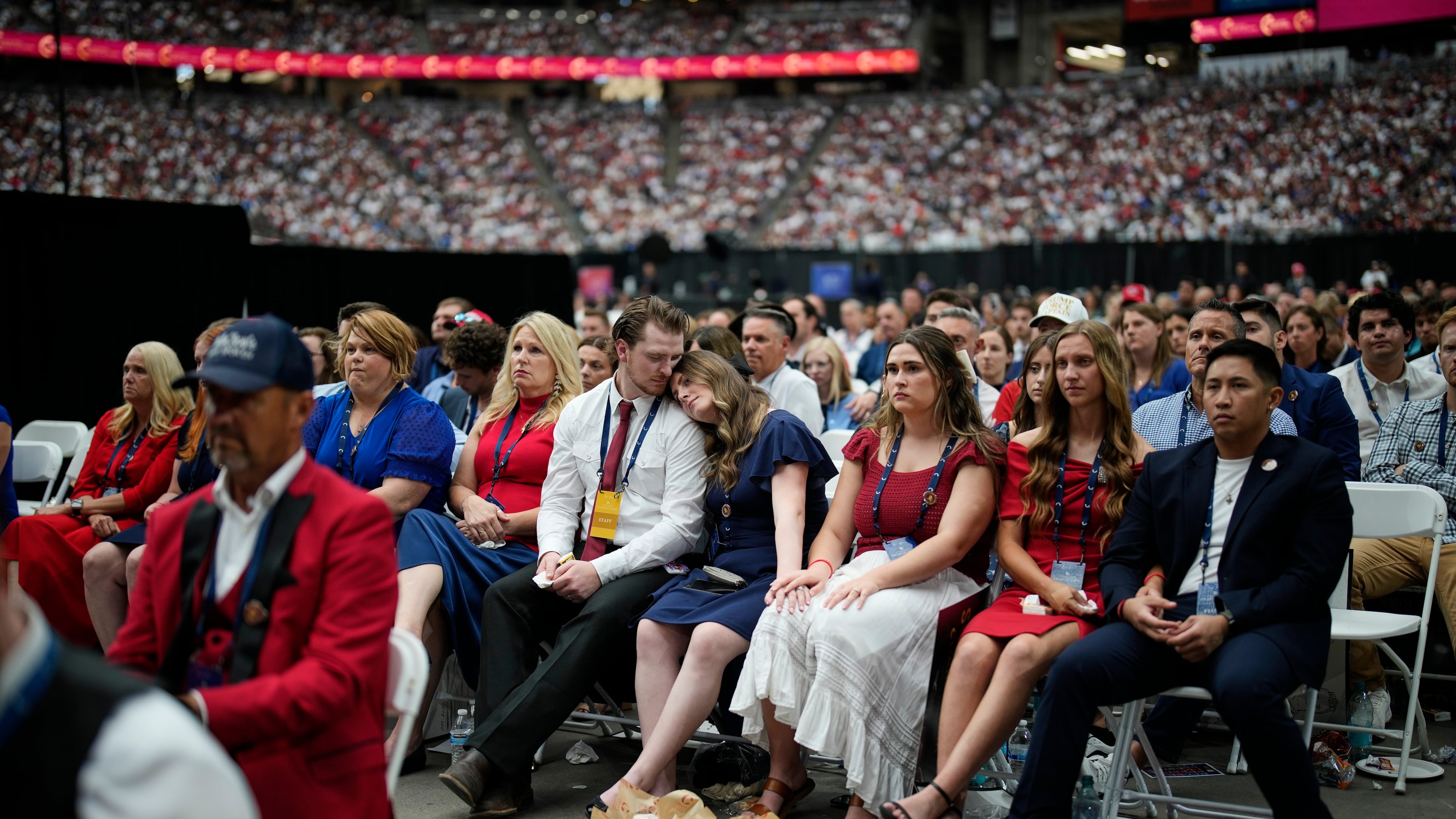 People listen as Erika Kirk speaks at a memorial for her late husband conservative activist Charlie Kirk, Sunday, Sept. 21, 2025, at State Farm Stadium in Glendale, Ariz. (AP Photo/John Locher)