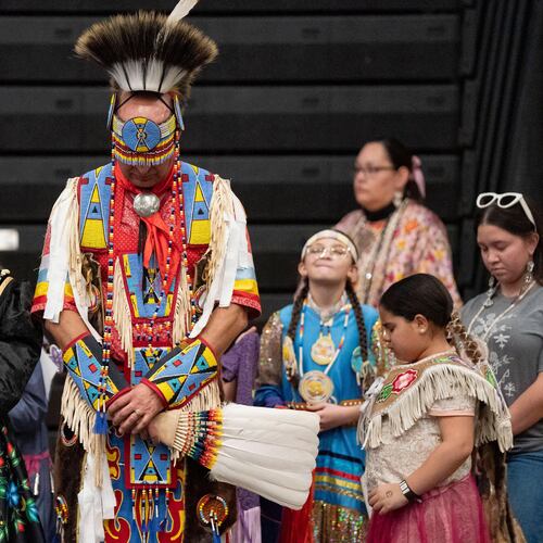FILE - Members of the Lumbee Tribe bow their heads in prayer during the BraveNation Powwow and Gather at UNC Pembroke, March 22, 2025, in Pembroke, N.C. (AP Photo/Allison Joyce, file)