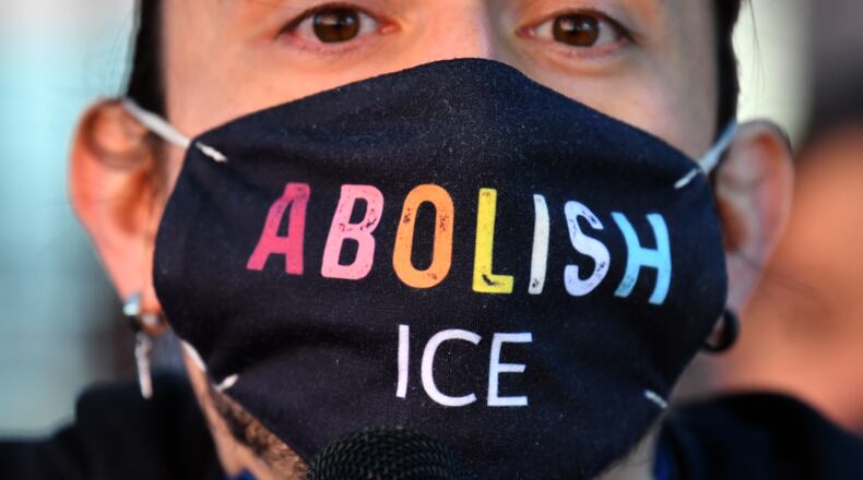 Elliot Lepe spoke during a rally to demand Biden to shut down detention centers, free immigrant detainees and stop deportations outside the ICE Atlanta Field Office on Thursday, September 23, 2021. (Hyosub Shin / Hyosub.Shin@ajc.com)