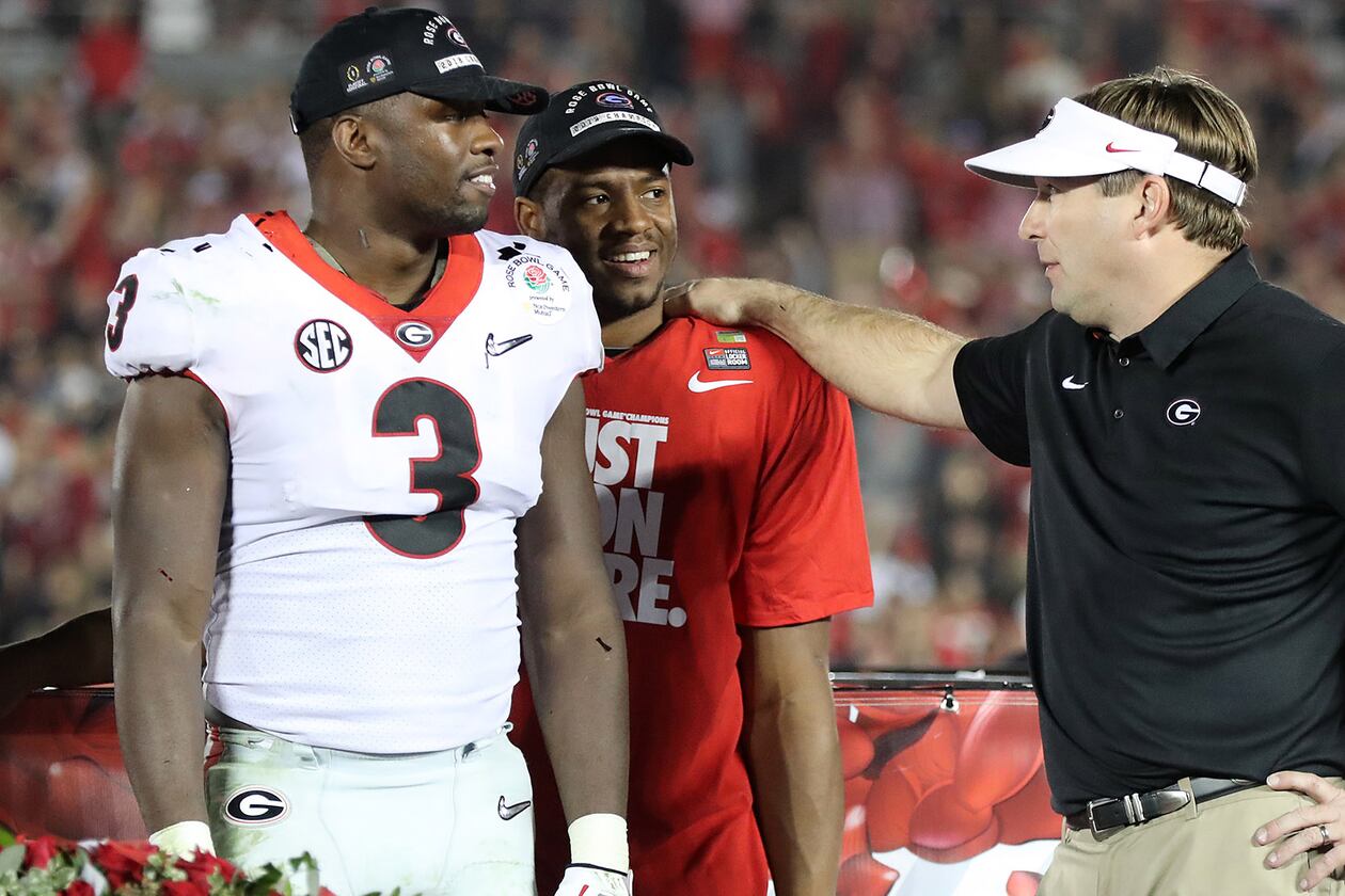 Georgia coach Kirby Smart (right) stands with Roquan Smith (left) and Nick Chubb after the Bulldogs beat Oklahoma 54-48 in double overtime in a College Football Playoff semifinal at the Rose Bowl in January 2018. (Curtis Compton/AJC)