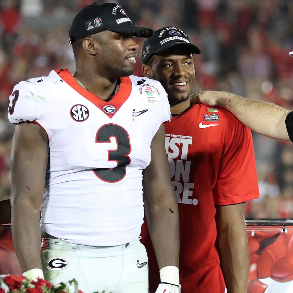 Georgia coach Kirby Smart (right) stands with Roquan Smith (left) and Nick Chubb after the Bulldogs beat Oklahoma 54-48 in double overtime in a College Football Playoff semifinal at the Rose Bowl in January 2018. (Curtis Compton/AJC)