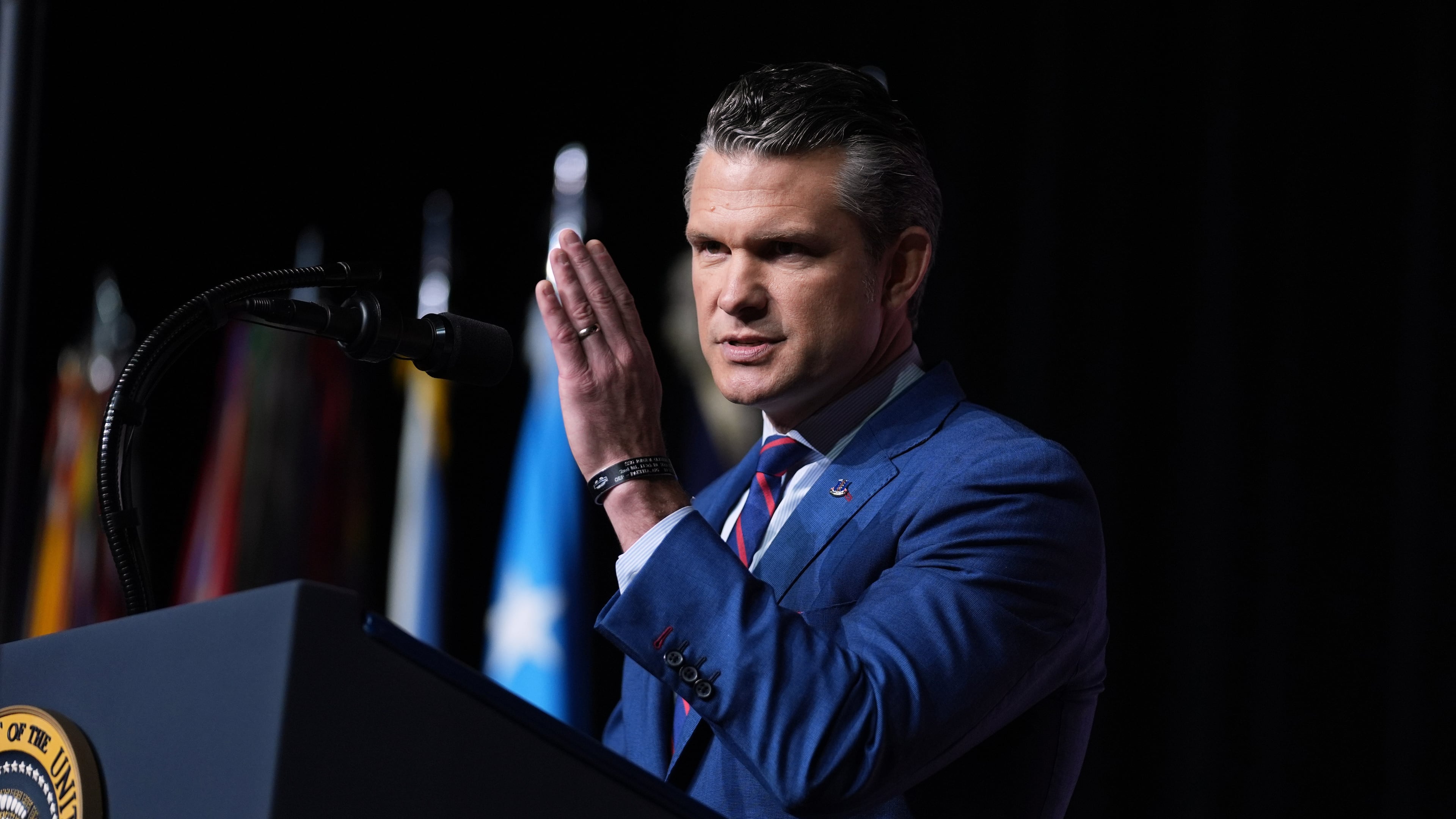 Defense Secretary Pete Hegseth speaks to a gathering of top U.S. military commanders at Marine Corps Base Quantico, Tuesday, Sept. 30, 2025, in Quantico, Va. (AP Photo/Evan Vucci)