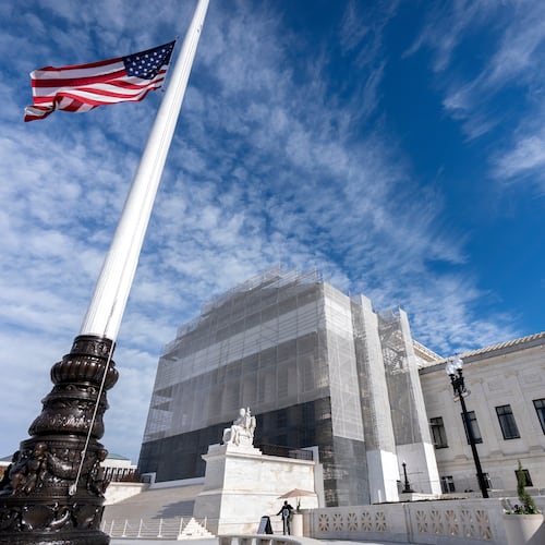 An American flag flies at half-staff outside the Supreme Court on Wednesday, Nov. 5, 2025, in Washington. (AP Photo/Mark Schiefelbein)