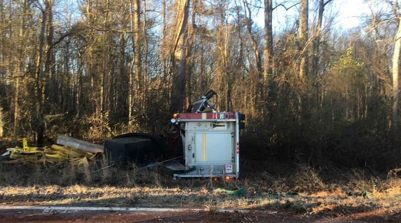 Driver Artis Johnson and firefighter Michael Murray were taken to Piedmont Walton Hospital in Monroe with moderate injuries, Walton County Fire Rescue officials said.