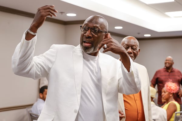 Reginald Thornton speaks to family members at a luncheon during the Thornton Family Reunion held in Atlanta on Saturday, June 28, 2025. (Natrice Miller/AJC)