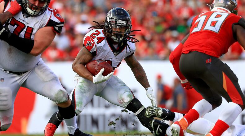 Atlanta Falcons running back Devonta Freeman (24) carries the ball against the Tampa Bay Buccaneers at Raymond James Stadium in Tampa, Florida, on December 29, 2019. (Mike Ehrmann/Getty Images/TNS)