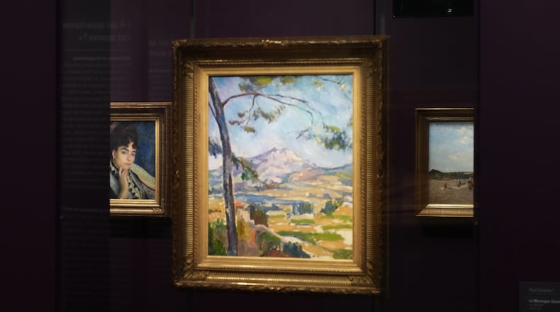 French painter Pierre-Auguste Renoir's painting, "Madame Alphonse Daudet," left, is seen at the Musée d'Orsay museum's new permanent gallery dedicated artworks recovered after World War II whose ownership remains uncertain, in Paris on Monday, May 4, 2026. (AP Photo/Thibault Camus)