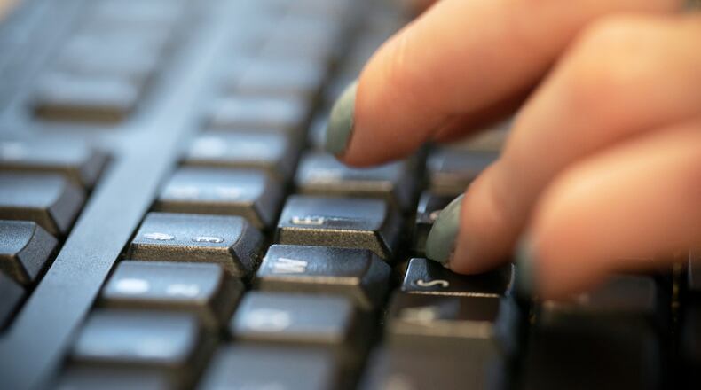 FILE - A person types on a computer keyboard in New York, Oct. 8, 2019. (AP Photo/Jenny Kane, File)