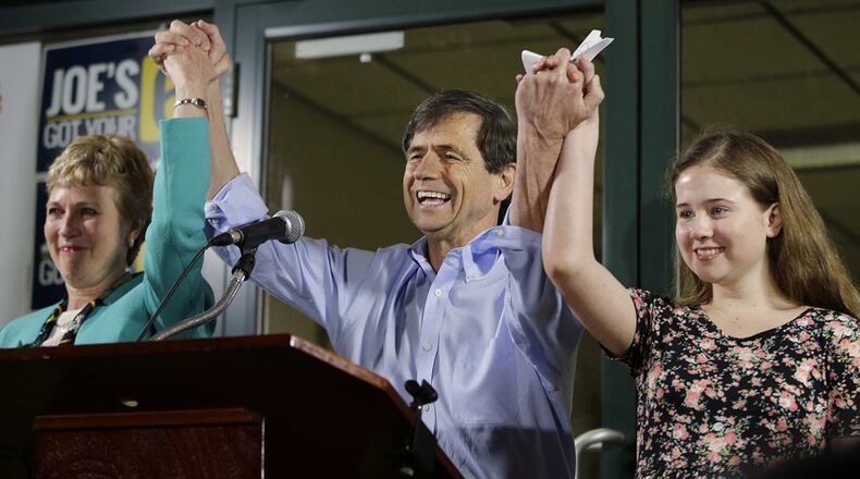 In this April 26, 2016, file photo, former Congressman Joe Sestak, center, his wife Susan Sestak, left, and daughter Alex Sestak react after speaking to supporters gathered outside his campaign headquarters in Media, Pa.