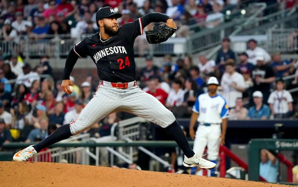 Minnesota Twins pitcher Simeon Woods Richardson delivers against the Atlanta Braves during the third inning of a baseball game Saturday, April 19, 2025, in Atlanta. (AP Photo/ John David Mercer)