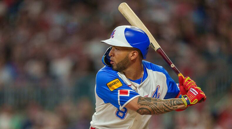 Atlanta Braves Eddie Rosario (8) eyes a pitch in the sixth inning of a baseball game against the Miami Marlins, Saturday, Aug. 3, 2024, in Atlanta. (AP Photo/Jason Allen)