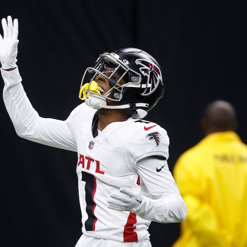 Atlanta Falcons wide receiver Darnell Mooney celebrates a touchdown reception against the New Orleans Saints in the second half of an NFL football game, Sunday, Nov. 23, 2025, in New Orleans. (AP Photo/Butch Dill)