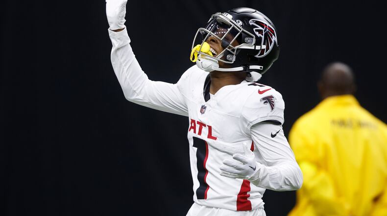 Atlanta Falcons wide receiver Darnell Mooney celebrates a touchdown reception against the New Orleans Saints in the second half of an NFL football game, Sunday, Nov. 23, 2025, in New Orleans. (AP Photo/Butch Dill)