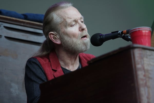 Rock legend Gregg Allman performs during the Music Midtown concert at Piedmont Park in Atlanta on Sept. 20, 2014. (Akili-Casundria Ramsess for the AJC)