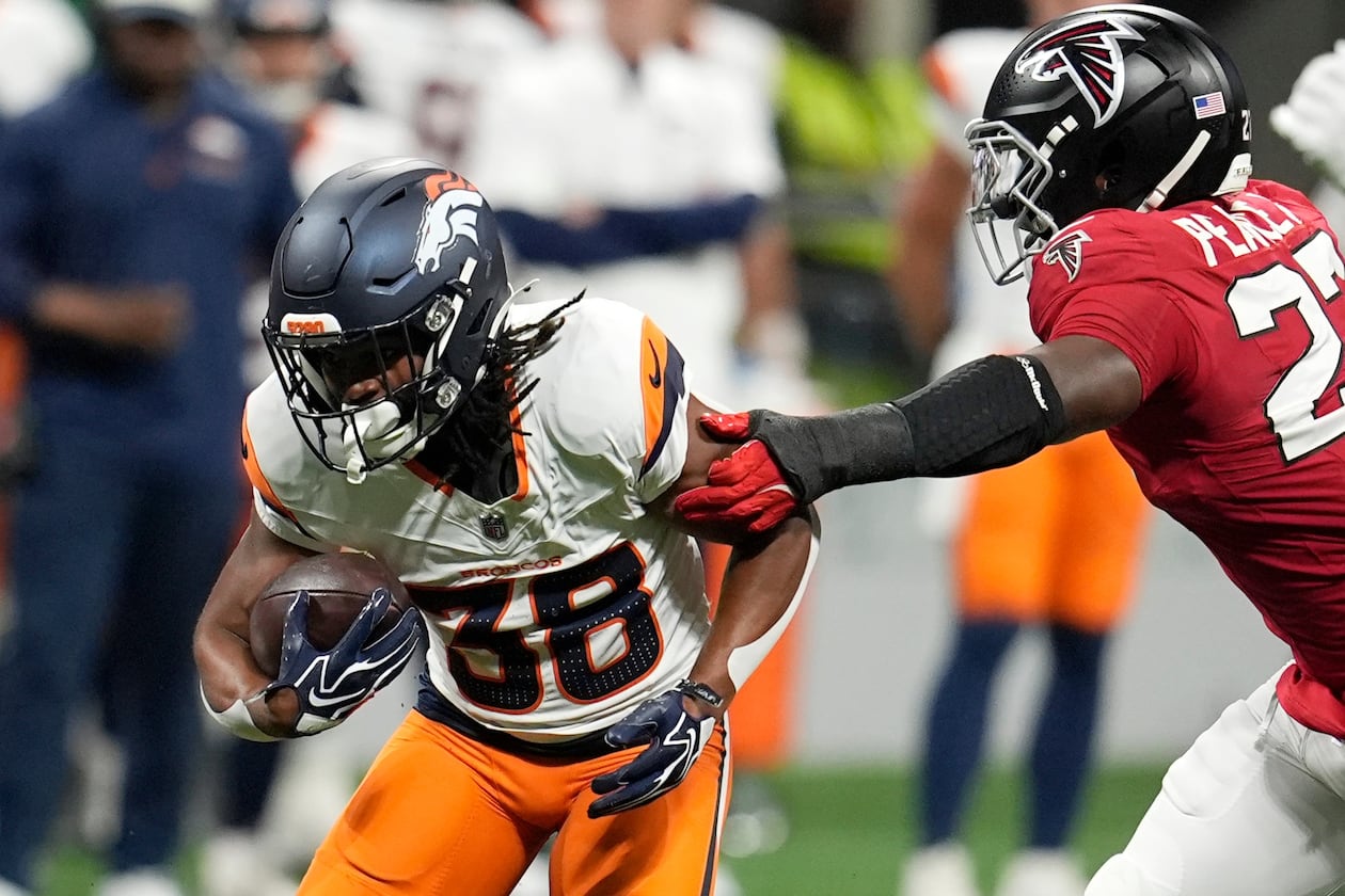 Denver Broncos running back Jaleel McLaughlin (left) runs against Atlanta Falcons linebacker James Pearce Jr. (right) during the first half of a preseason NFL football game, Friday, Aug. 14, 2026, in Atlanta. (Mike Stewart/AP)