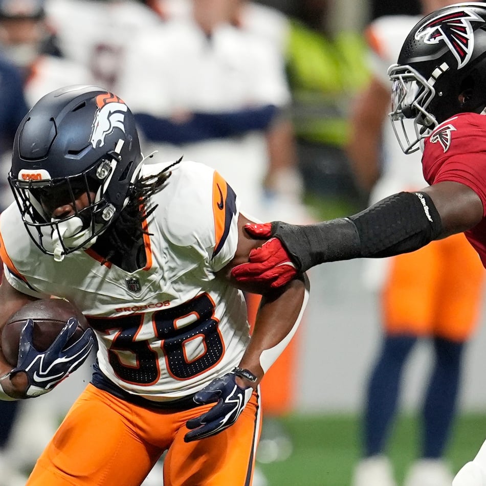 Denver Broncos running back Jaleel McLaughlin (left) runs against Atlanta Falcons linebacker James Pearce Jr. (right) during the first half of a preseason NFL football game, Friday, Aug. 14, 2026, in Atlanta. (Mike Stewart/AP)