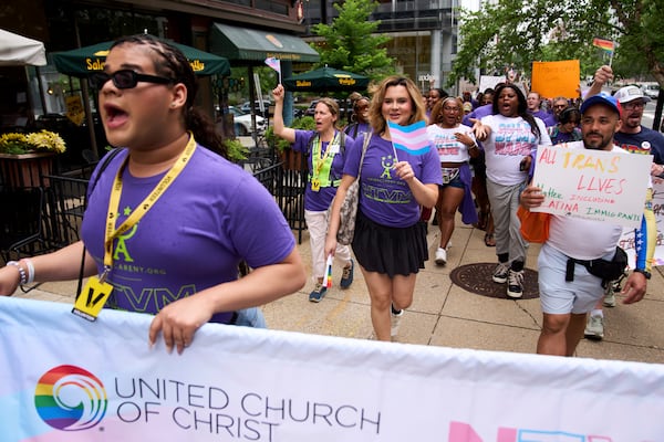Bella Bautista, 22, center, a transgender woman, attends the National Trans Visibility March, en route to join the World Pride Rally on the National Mall, Sunday, June 8, 2025, in Washington. (AP Photo/Jacquelyn Martin)