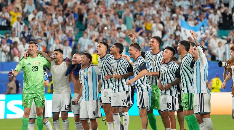 Players of Argentina celebrate after the World Cup round of 32 soccer match against Cape Verde in Miami Gardens, Fla., Friday, July 3, 2026. (AP Photo/Rebecca Blackwell)