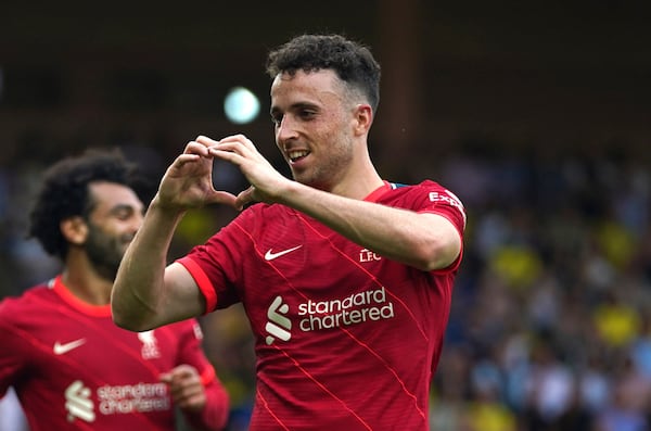 FILE - Liverpool's Diogo Jota celebrates scoring during the Premier League match at Carrow Road, Norwich, Saturday Aug. 14, 2021. (Joe Giddens/PA via AP, File)