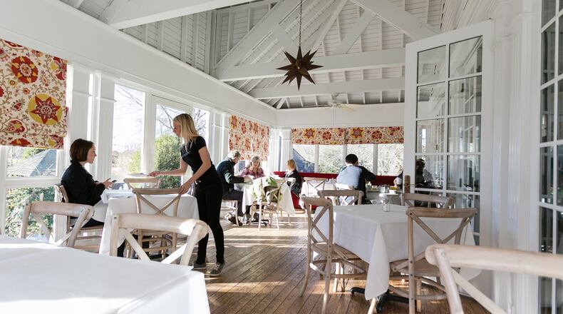 The Farmhouse offers wooded views from its glass porch. CONTRIBUTED BY J. ASHLEY PHOTOGRAPHY