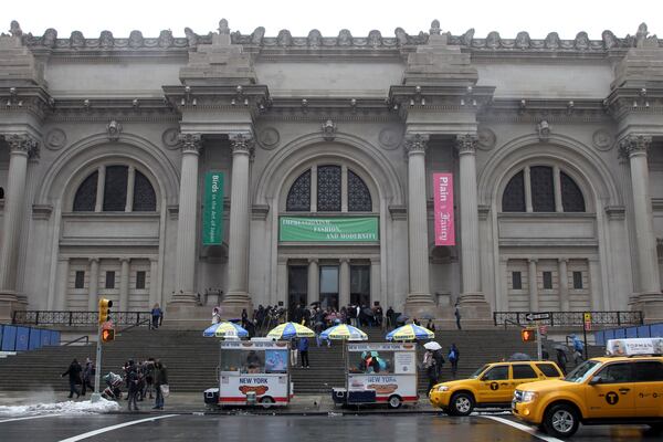 FILE - Taxis pass the Metropolitan Museum of Art on March 19, 2013, in New York. (AP Photo/Mary Altaffer, File)