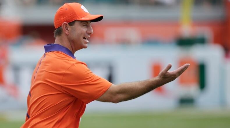 Clemson head coach Dabo Swinney argues a call during the first half of an NCAA College football game, Saturday, Oct. 24, 2015 in Miami Gardens, Fla. No. 6 Clemson handed Miami its worst defeat in the program's 90-year history Saturday, rolling to a 58-0 win to remain unbeaten. (AP Photo/Wilfredo Lee)