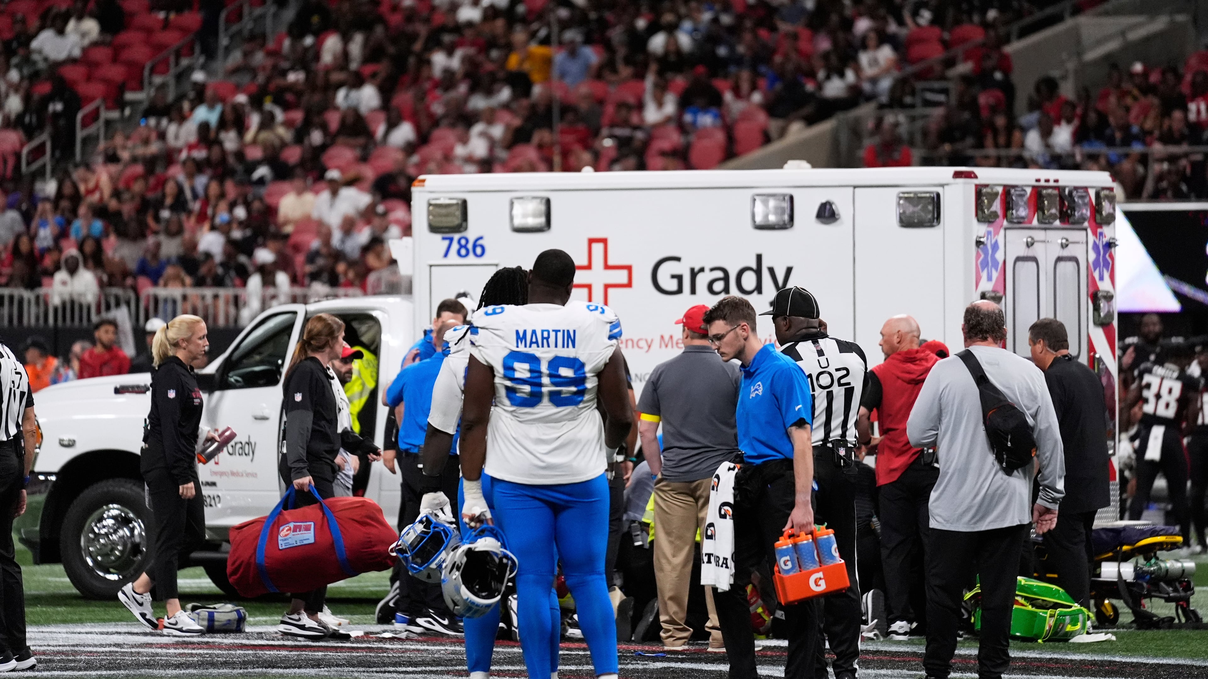 An ambulance prepares to transport Detroit Lions safety Morice Norris after being injured against the Atlanta Falcons during the second half of an NFL preseason football game Friday, Aug. 8, 2025, in Atlanta. (AP Photo/Brynn Anderson)