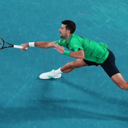 Novak Djokovic of Serbia plays a forehand return to Pedro Martinez of Spain during their first round match at the Australian Open tennis championship in Melbourne, Australia, Monday, Jan. 19, 2026. (AP Photo/Aaron Favila)