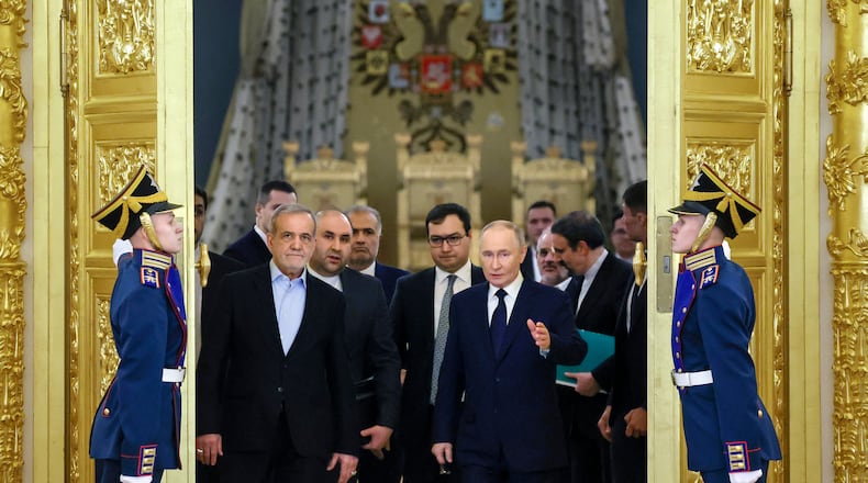 FILE - Iranian President Masoud Pezeshkian, center left, and Russian President Vladimir Putin, center right, arrive at a ceremony following their talks at the Kremlin in Moscow, Russia, on Jan. 17, 2025. (Vyacheslav Prokofyev, Sputnik, Kremlin Pool Photo via AP, File)