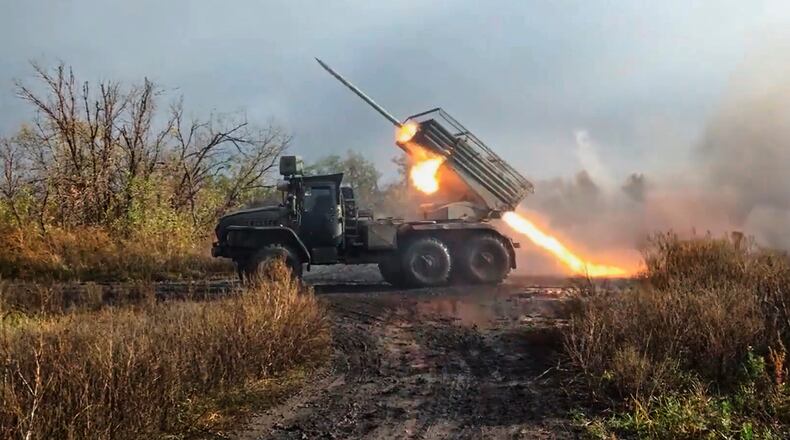 In this image made from video provided by Russian Defense Ministry Press Service on Friday, Nov. 7, 2025, a Russian "Grad" self-propelled 122 mm multiple rocket launcher fires towards Ukrainian positions on an undisclosed location in Ukraine. (Russian Defense Ministry Press Service via AP)