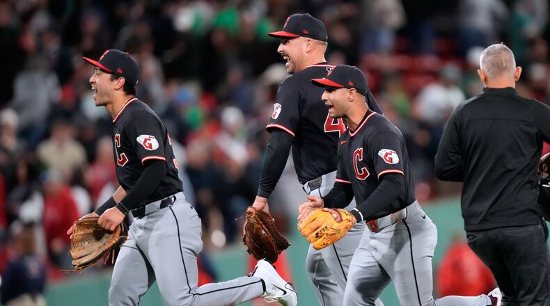 Cleveland Guardians' Nathaniel Lowe, center, celebrates with teammates after defeating the Boston Red Sox following a baseball game, Tuesday, Sept. 22, 2026, in Boston. (AP Photo/Charles Krupa)