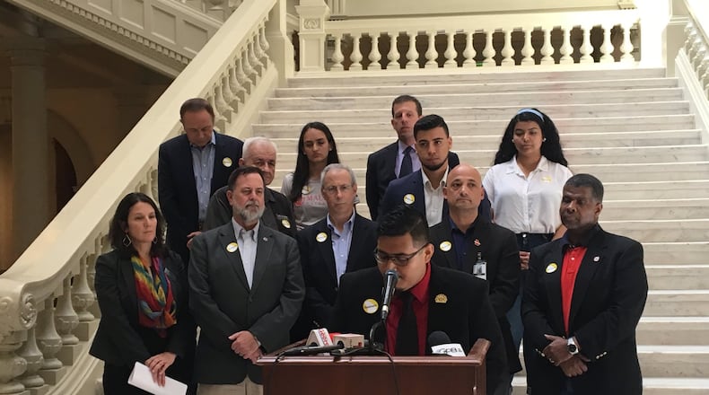 Geovani Serrano of the Georgia Latino Alliance for Human Rights speaks Friday at the state Capitol about a bill that would create a hate-crimes law in Georgia. He’s surrounded by representatives from other groups supporting the hate-crimes bill, House Bill 426. MARK NIESSE / MARK.NIESSE@AJC.COM
