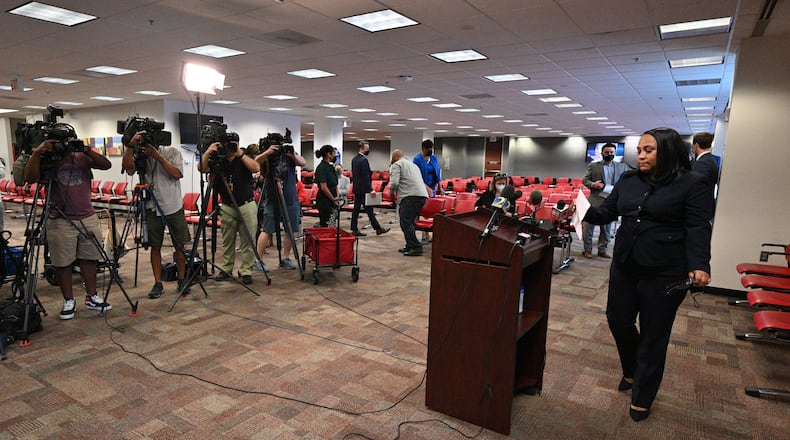 May 11, 2021 Atlanta - Fulton County's district attorney Fani Willis walks to the podium before she speaks to members of press during a press conference on indictment of Atlanta spa shooting suspect Robert Long at Fulton County Courthouse Judicial Center Tower on Tuesday, May 11, 2021. Eight weeks after eight people were killed at three metro Atlanta spas, a Fulton County grand jury has indicted the alleged gunman, the District Attorney’s Office said Tuesday. Prosecutors also plan to seek the death penalty and pursue hate crime charges, according to court filings. (Hyosub Shin / Hyosub.Shin@ajc.com)