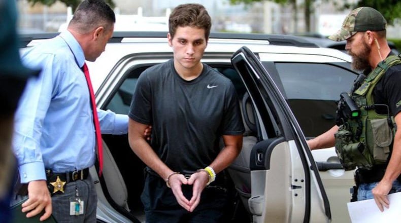 Austin Harrouff is transported by detectives to the Martin County Jail from St. Mary’s Hospital on October 3, 2016. Harrouff, who allegedly fatally stabbed a Martin County couple in their home on August 15th, has officially been charged with two counts of first-degree murder. (Richard Graulich / The Palm Beach Post)