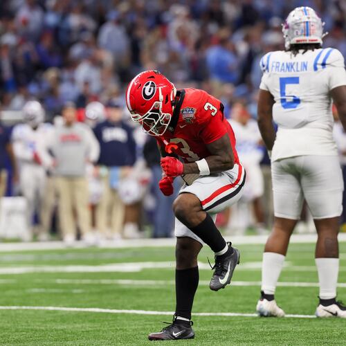 Georgia Bulldogs running back Nate Frazier celebrates a first down against the Ole Miss Rebels during the Sugar Bowl at the Caesars Superdome on Thursday, Jan. 1, 2026, in New Orleans. Frazier ran for 947 yards while scoring six touchdowns in 2025, emerging as the team’s leading running back. (Jason Getz/AJC)