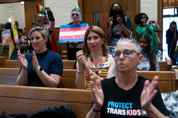 Transgender rights supporters rally at the Lutheran Church of the Reformation on Capitol Hill, Wednesday, June 18, 2025, in Washington after the Supreme Court upheld Tennessee's ban on gender-affirming care for transgender minors, in a setback to transgender rights. (AP Photo/Jose Luis Magana)