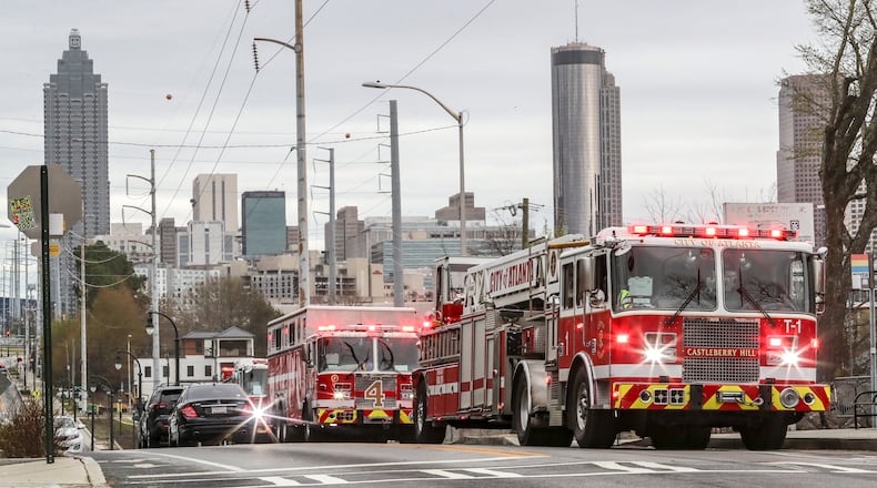 March 2, 2023 Atlanta: A fire at an old home converted into apartments in northwest Atlanta is being investigated after it displaced at least two residents Thursday morning, March 2, 2023 fire officials said. Firefighters were called to the home at 8:40 a.m. for a working fire near the corner of Joseph E. Boone Boulevard and Sunset Avenue, according to Atlanta Fire Battalion Chief Arzell Bostick II. Upon arrival, the fire crew immediately began searching the building after getting reports of someone trapped inside, Bostick said. Firefighters searched both levels of the house but did not find anyone, so began working to extinguish the flames. George Henderson, one of the residents, said he woke himself up coughing to find his room filled with smoke. Henderson went outside and could see smoke and fire coming from a second-story window. “At that point, I ran back in there yelling, ‘It’s on fire, somebody call 911,’ and started throwing my stuff out,” Henderson said. According to Henderson, he was one of three residents living at the home, but the other two men were already gone and he was the last one out. He said he planned to work with Red Cross volunteers once they arrived. The fire was extinguished after firefighters cut through the roof to provide top-side ventilation and find any hidden fire, Bostick said. No injuries were reported as a result of the blaze, and the cause of the fire remains under investigation. (John Spink / John.Spink@ajc.com)