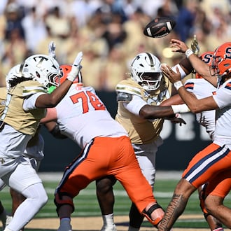 Syracuse quarterback Rickie Collins gets off a pass under pressure from Georgia Tech’s defense at Bobby Dodd Stadium on Saturday, Oct. 25, 2025, in Atlanta. Collins transferred to Syracuse in December 2024 after two years at LSU. (Hyosub Shin/AJC 2025)