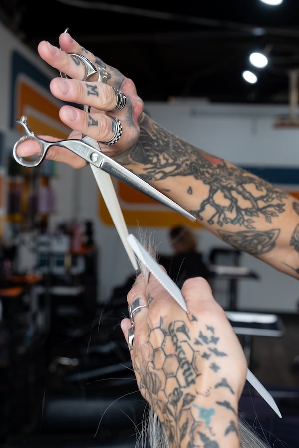 Stylist Keenan Artelli works on Angie Bowling’s hair at Keenan Salon in Atlanta on Thursday, June 18, 2026. (Ben Gray for the AJC)