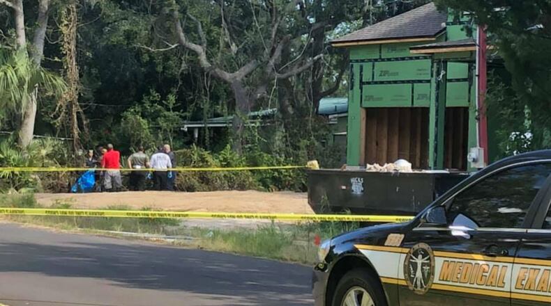 A woman's body was found Saturday inside a burned port-a-potty in front of a home under construction in Florida, investigators said.